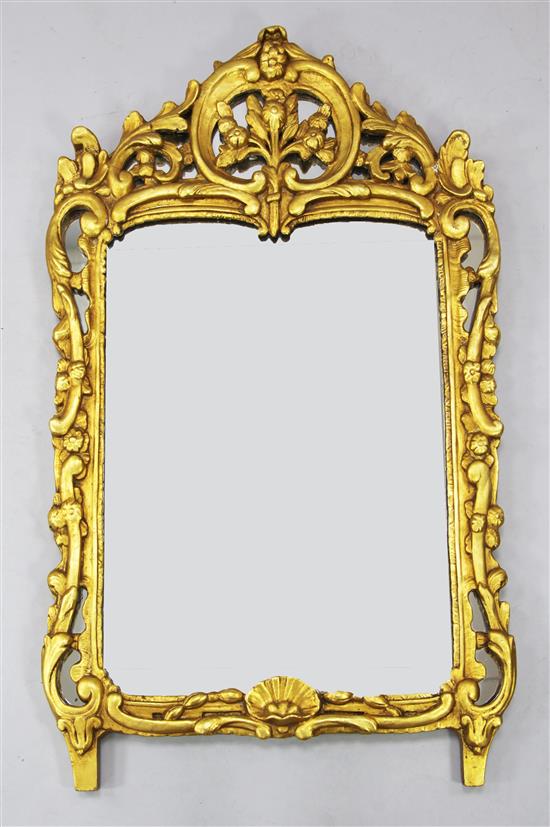 A mid 18th century Italian style carved giltwood wall mirror, the plate 2ft 2in. x 1ft 8in.